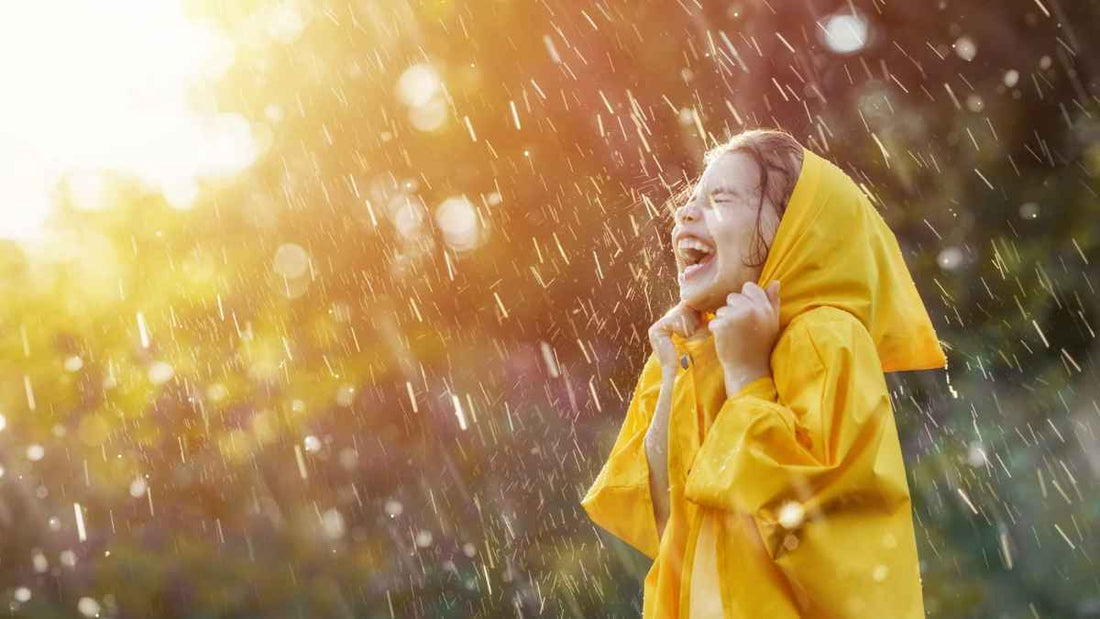 girl laughing in rain