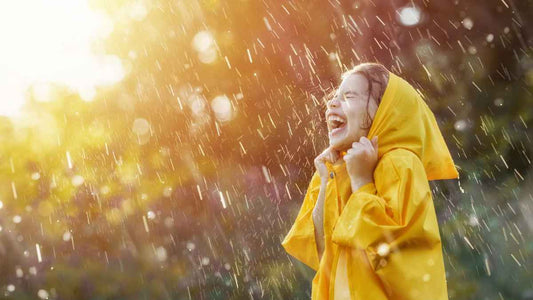 girl laughing in rain
