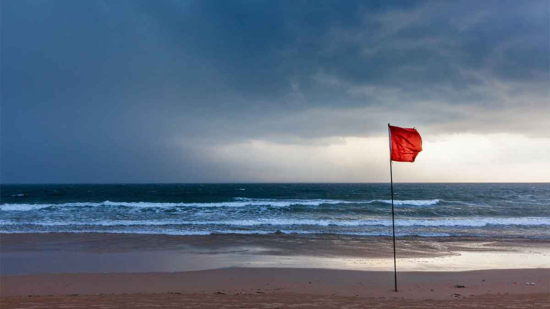 storm warning flag on beach
