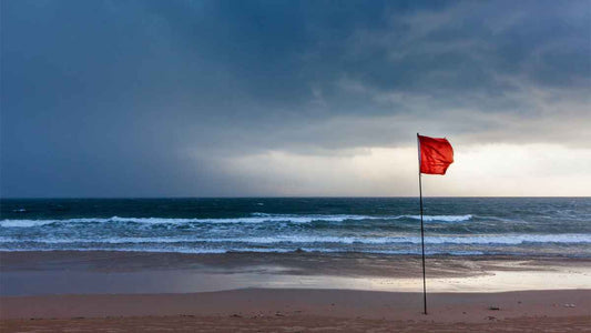storm warning flag on beach