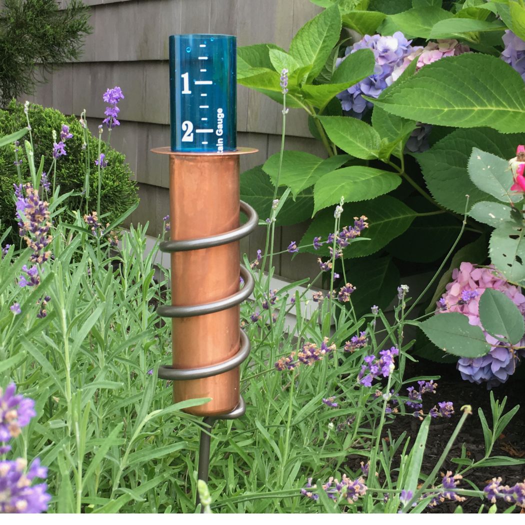 Unique Rain Gauge In Cottage Garden