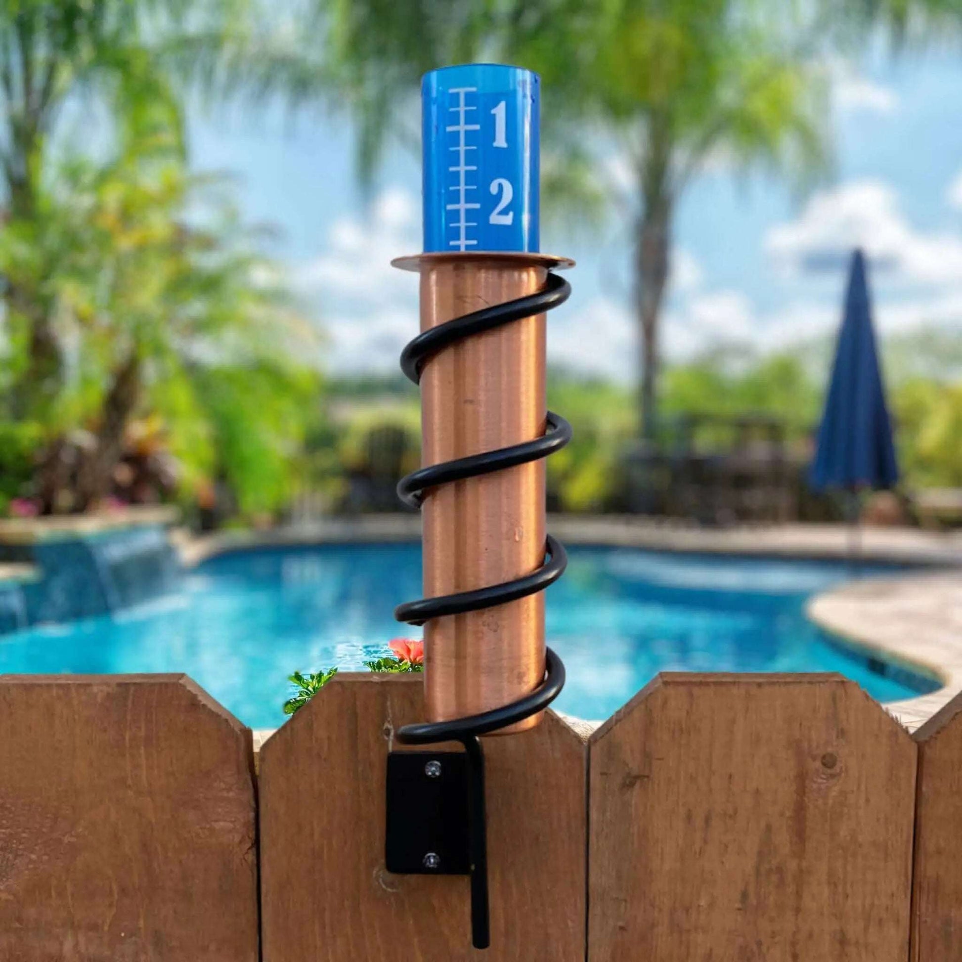 Fence Mount Copper Rain Gauge By Backyard Pool